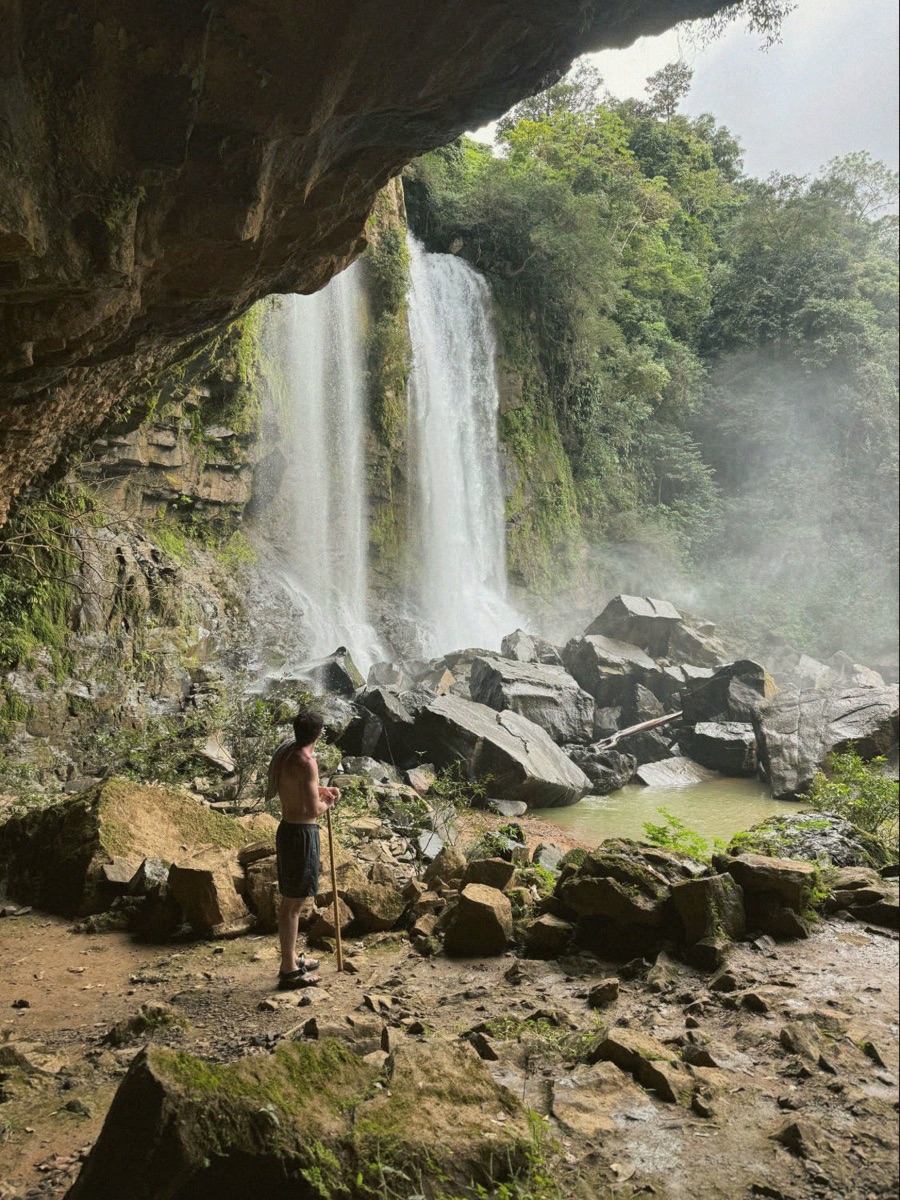 Finn facing a jungle waterfall in Costa Rica